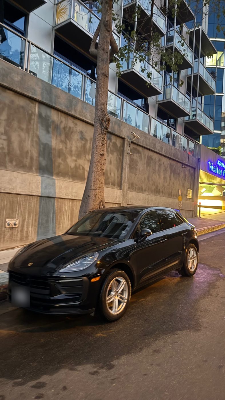Black Porsche Macan with glossy clean paint after a Redline Detail exterior detail